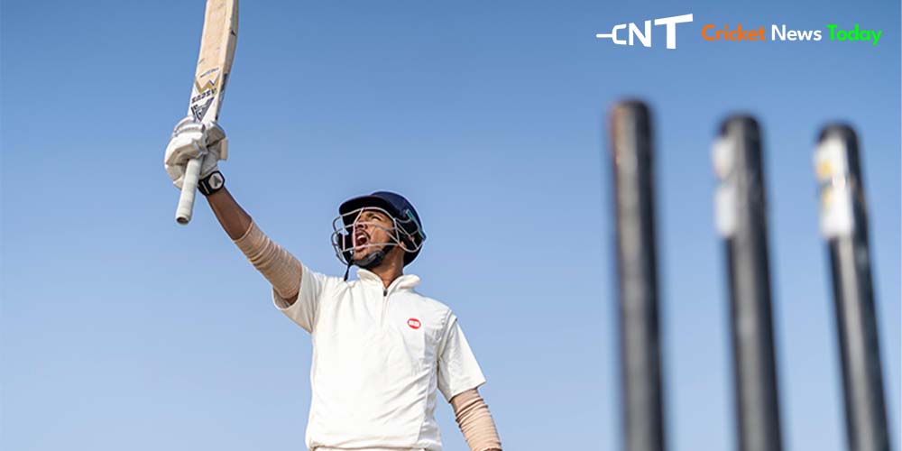 cricketer waving english willow cricket bats