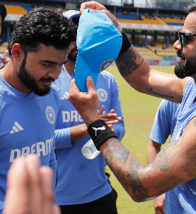 riyan receives odi cap from virat